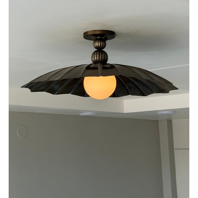 Add timeless character and artistic elegance to your interior with this handmade black antique brass semi-flush mount...