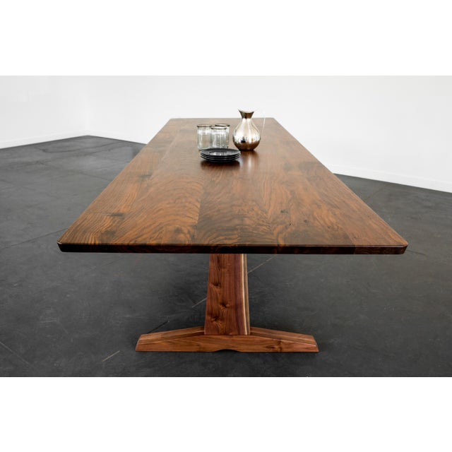 Purpose and design align in our Columbia trestle table. A solid trestle base is the grounding feature in this beautifully...