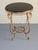 Elegant vintage accent table crafted in the style of famed French designer René Drouet, featuring a sculptural gilt iron...