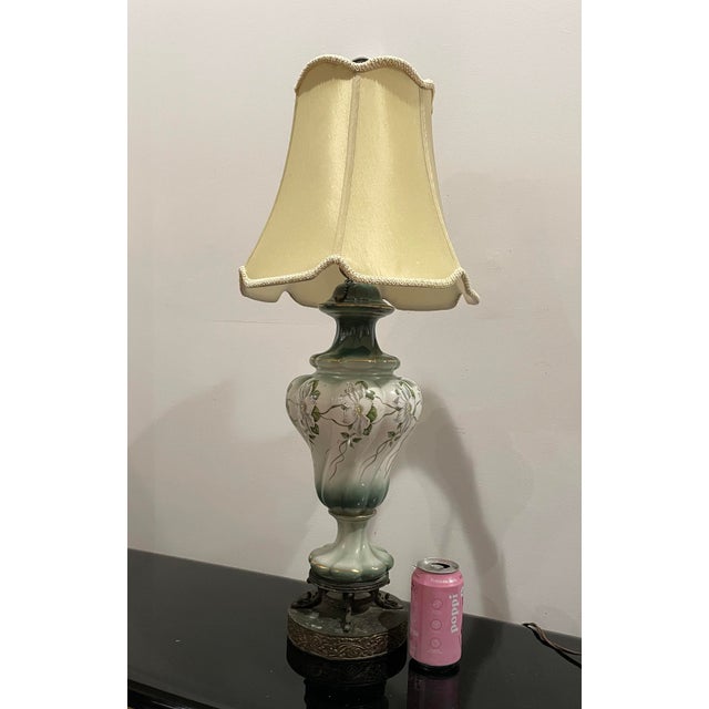 Hand-painted ceramic table lamp dating to the early–mid 1930s, featuring a soft celadon-to-jade green glaze with raised...