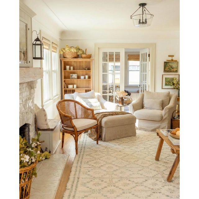 An elegant mid-century faux bamboo cane lounge chair in the highly sought-after Hollywood Regency / Palm Beach style. This...