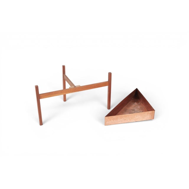A distinctive 1960s Danish plant stand combining solid teak and copper. The warm amber of the teak plays perfectly against...
