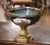 Crafted in Paris circa 1860, this elegant antique Sèvres-style jardinière features a richly mounted gilt bronze frame...