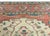 A stunning late 19th century Persian Serapi rug with a large central stylized indigo floral medallion living amidst a...