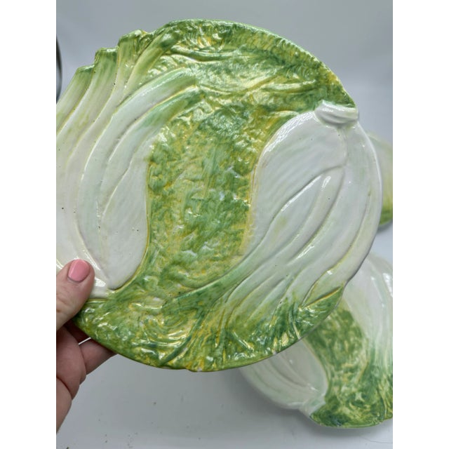 Lovely hand painted Italian plates, set of four. Depicting celery stalks, these are pretty for display or could be very...