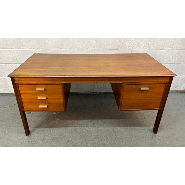 Bring iconic Scandinavian design into your home or office with this exceptional Mid-Century Danish teak desk by Farstrup...