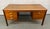 Bring iconic Scandinavian design into your home or office with this exceptional Mid-Century Danish teak desk by Farstrup...