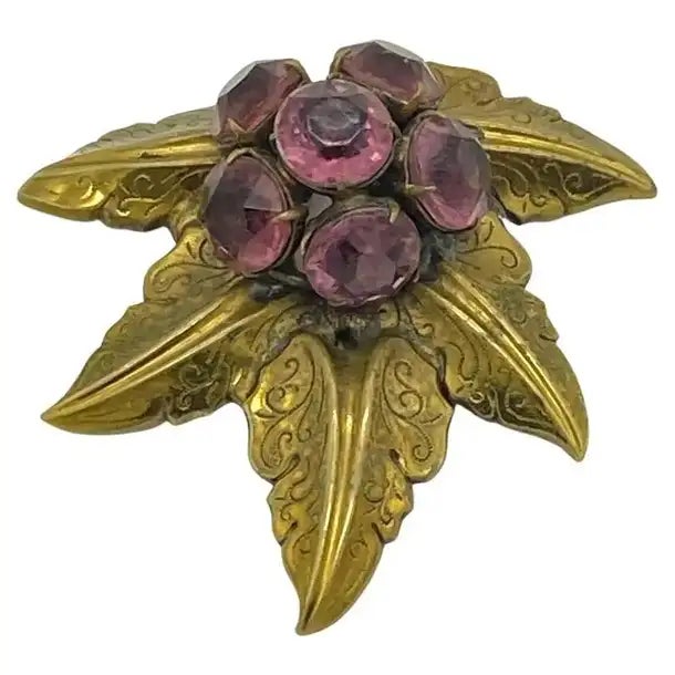 This is a signed Style Metal Spec. N.Y. dress clip that comes with brass stylized maple leaves and prong set faceted...