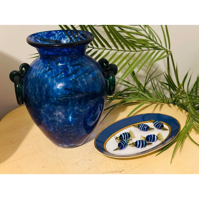 A fun set of blown glass candies. Different tones of blue and touch of white.