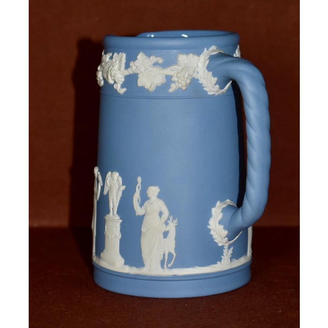 Vintage (1950's) Decorative Pitcher/Creamer made of Jasperware. The Brand is Wedgwood. The color is Blue & White. The...