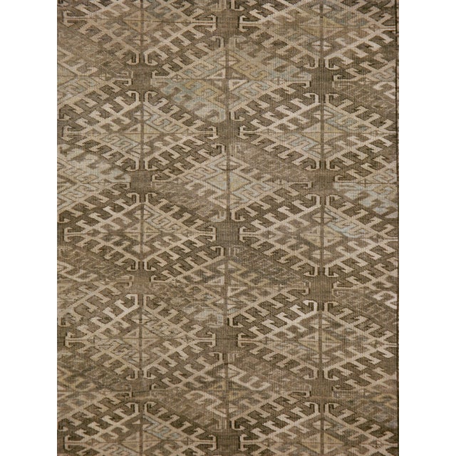 An antique central Asian Turkoman carpet from the early 20th century. Measures: 6' 5" x 9' 11"