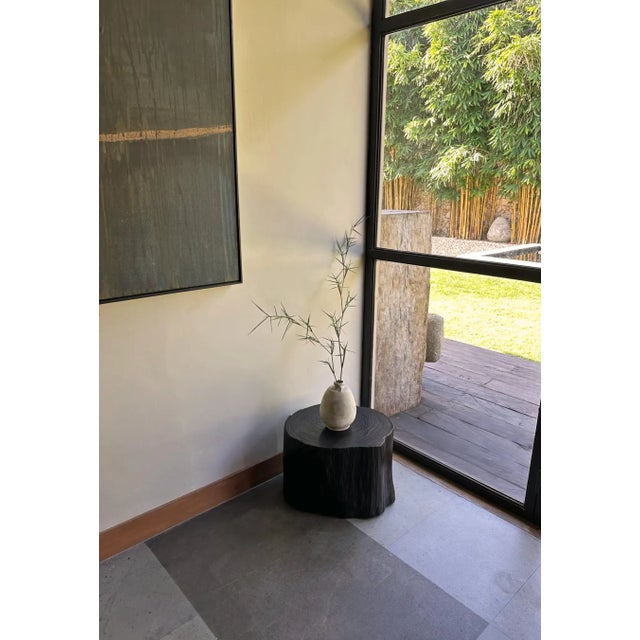 A wonderfully organic round side table. Its neutral pigment and subtle wood texture makes it perfect for any space. This...