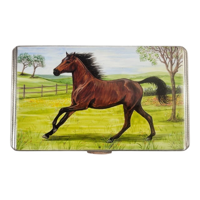 A refined and highly decorative British sterling silver cigarette case, hallmarked Birmingham 1917, with an impressive...