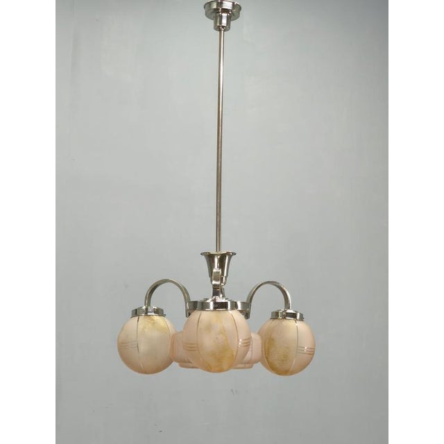 Elegant Art Deco chandelier manufactured in Czechoslovakia during the 1940s. The design combines a polished chrome-plated...