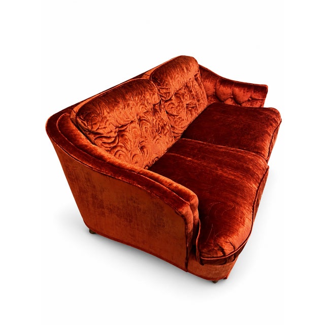 A wonderfully dramatic vintage loveseat dating to approximately the 1970s or early 1980s. The loveseat features a softly...