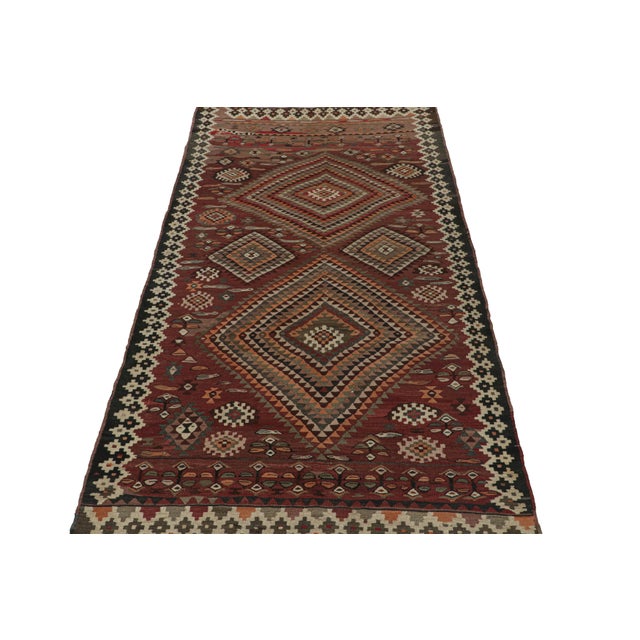 This vintage 5x10 Persian Kilim is a believed to be a Shahsavan tribal rug, handwoven in wool circa 1950-1960. The design...