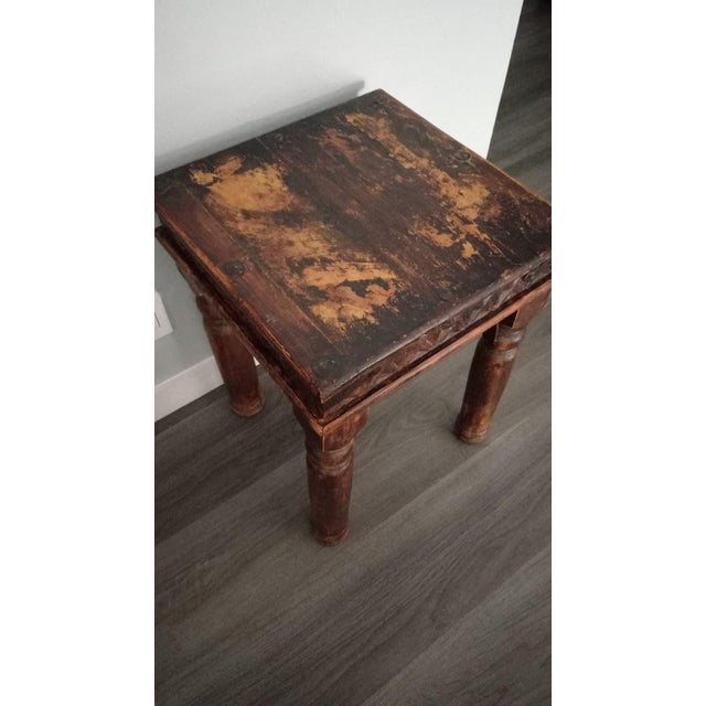 This is a dense, solid hardwood type of Thakat side table. Its appearance is rustic featuring a hand-carved, geometric...