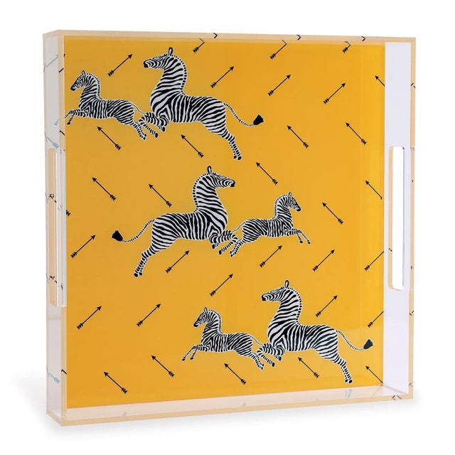 We love the whimsy of the square lucite zebra tray. The Scalamandre zebra pattern in the color of yellow is your fun...