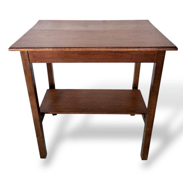 A solid and characterful Arts & Crafts oak hallway table, featuring the honest craftsmanship and simple architectural...