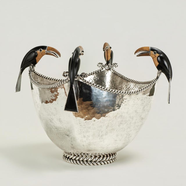 Standout vintage bowl handcrafted in silver plate on hammered copper with a jewelry like twisted rim and foot, featuring...