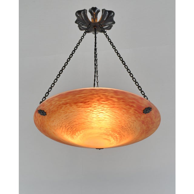 Daum freres & Louis Majorelle A wonderful French art deco pendant light in wrought iron with a wide Daum bowl in mottled...