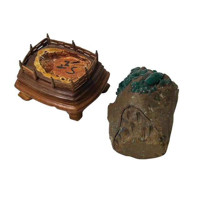 This naturalistic scholar’s rock or table sculpture is carved from a dark, rustic stone matrix designed to resemble an...