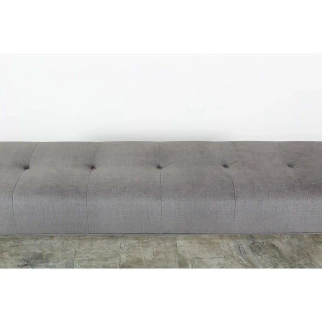Elegant Mid-century brass bench with gray velvet cushion top cushion have been newly upholstered in a luxurious gray...