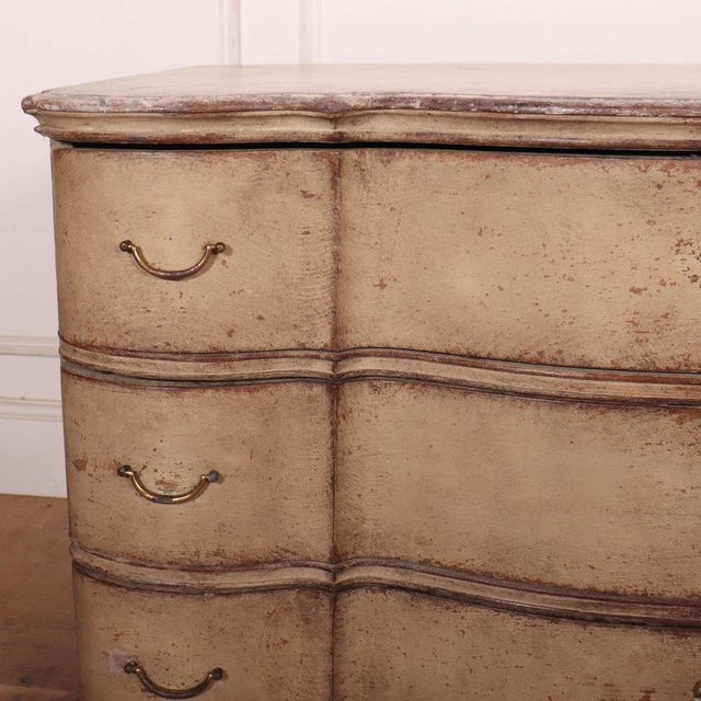 Wonderful 18th C Danish serpentine front 3 drawer oak commode with faux marble top. 1780 This piece is designed in the...