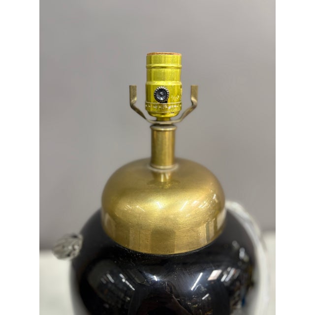 Bold piece of vintage black glass vase lamp with clear glass spiral on the sides. Gold colored lid and base. Dimensions:...
