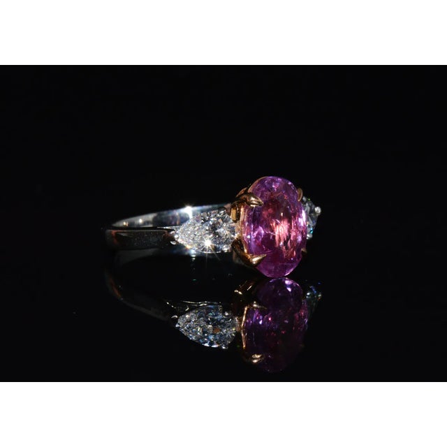 GIA certified 3.88CTS diamond and pink sapphire three stone solid 950 platinum / 18K rose gold ring. This ring features a...