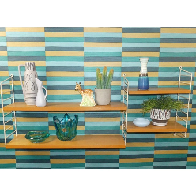 An absolute classic! simple, swedish design design classic nisse strinning designed his famous shelving system in 1949. It...