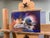 The artwork features a crow skull rendered in vibrant oil colors on aluminum, showcasing a striking interplay of light and...