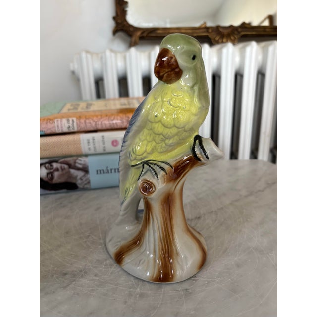 Vintage hand-painted ceramic parrot figurine on a tree stump. No maker's mark. Marked Made in Brazil. I ship quickly and...
