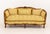 Louis XV Yellow Silk Damask Upholstered Walnut Sofa, the carved wood frame with floral motifs. 34" H x 74" W x 31" D;...