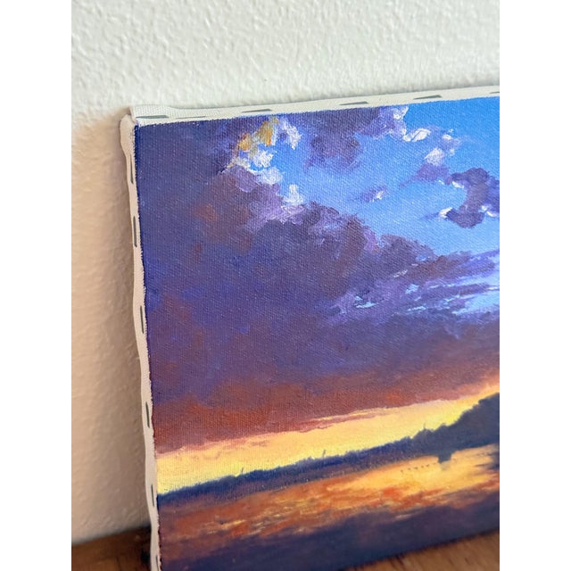 Stunning oil painting of a deep sunset over a lake landscape, by Robert Valton Hill. The quality of the painting is...