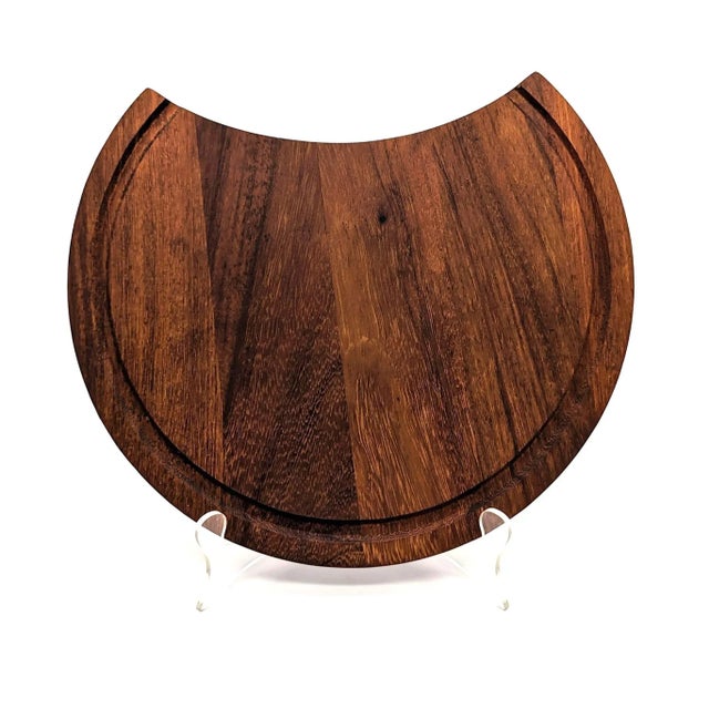 Offered is a dark-grain staved Teak wood carving board that performs double duty as a cheese and charcuterie tray that has...