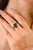 This vintage-inspired ring features a 2.37-carat natural heart-shaped emerald measuring approximately 10x10 mm. The...