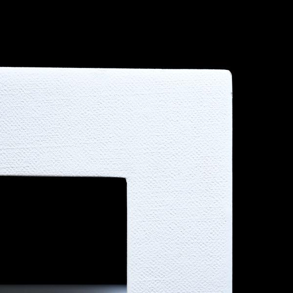 A rectangular coffee table wrapped in natural linen, the textile surface bringing soft, tailored texture to a clean modern...