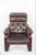 A Scandinavian modern lounge chair that does the clever thing: the whole seat floats on a cantilevered bentwood frame, so...