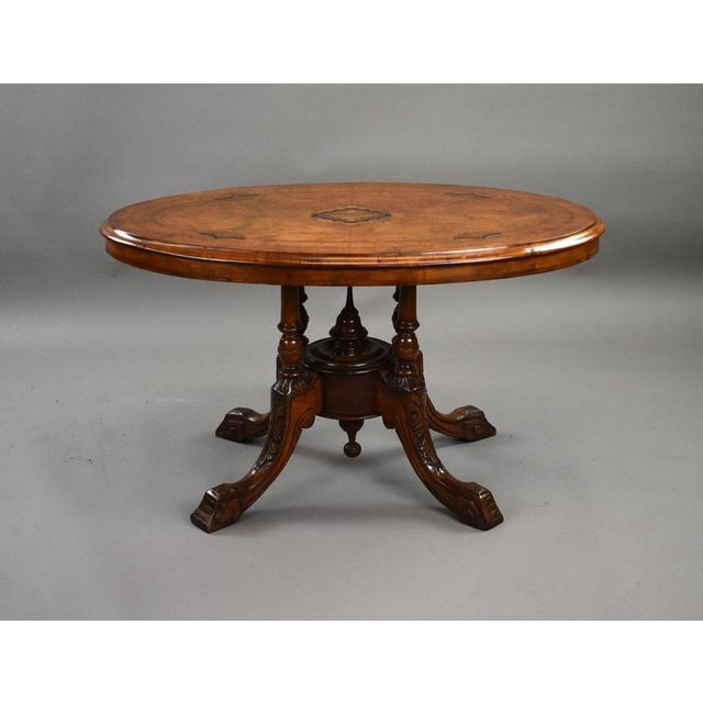 A very attractive Victorian oval occasional table, English, dating to the mid 19th century. The table is finely veneered...