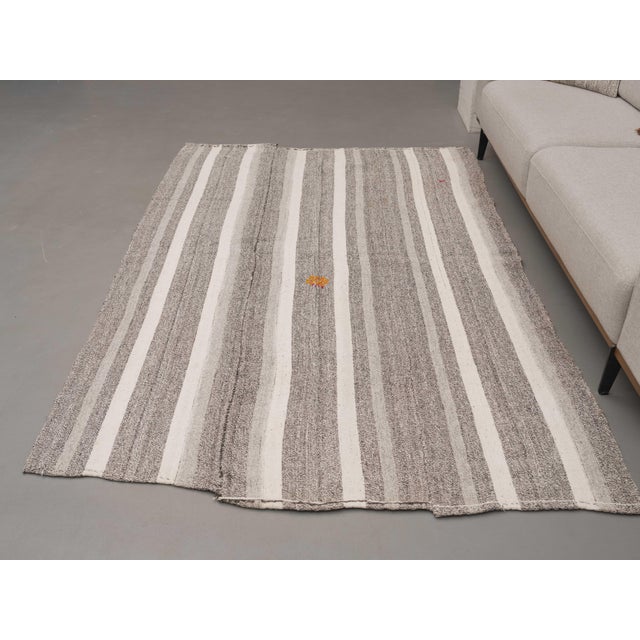 Vintage Hand-Knotted runner rug is a semi-antique vintage area rug. The '70s Eastern region of Anatolia's unique rug is...
