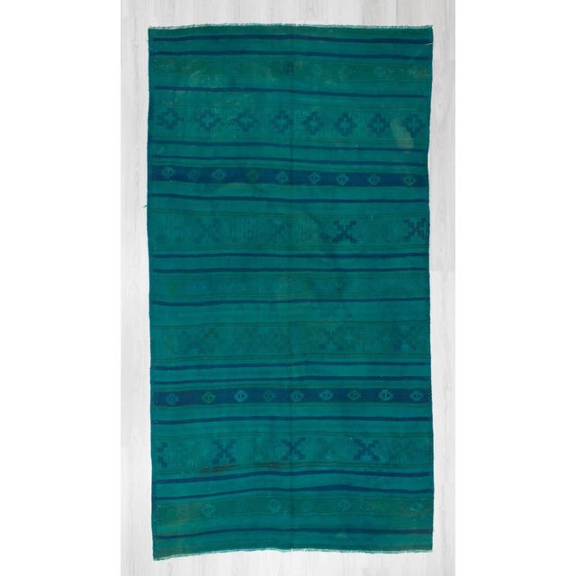 Handwoven vintage blue and aqua over dyed kilim rug from Denizli region of Turkey. In very good condition. Approximately...