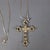 Up for sale is a charming vintage necklace from the 1970s, featuring a striking cross-shaped pendant crafted with an...