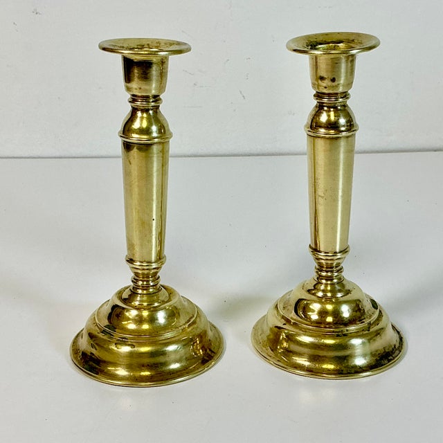 This pair of Mid-Century Brass Candlestick Holders are heavily patinated with character and charm. These are hollow ware...
