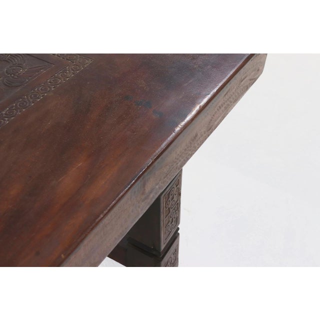 Unique solid tropical hard wooden dining table from around the 1920s. The 15 cm thick top is made out of one entire slab...