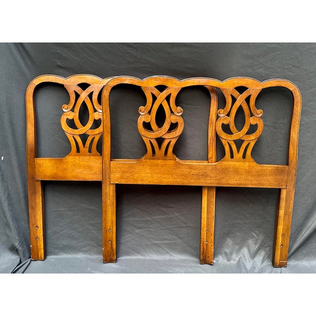 A handsome pair of vintage twin headboards by Henredon Fine Furniture, featuring an elaborate pierced fretwork design...