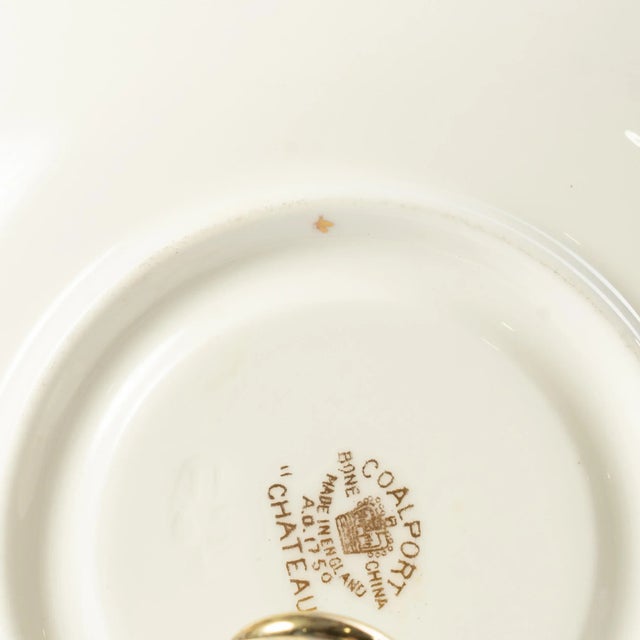 This Coalport "Chateau" set includes 14 tea cups w/ saucers. The saucers measure 6 7/8" and the tea cups measure 4 1/8" in...