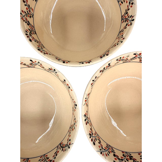 A distinctive set of five Bat Trang ceramic soup bowls, made in Vietnam and decorated with an elegant repeating botanical...
