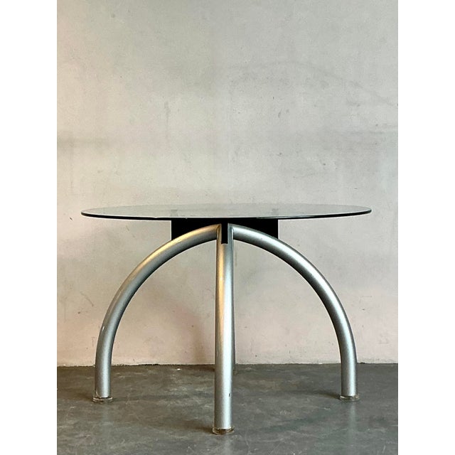 Inject a dose of postmodern cool into your dining space with this fantastic vintage dining table, created in the spirit of...