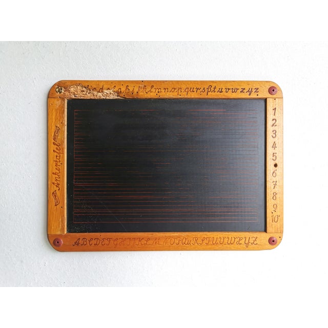 This small blackboard from the company ANKERTAFEL (est. 1862) with a writing and calculating surface originates from a...